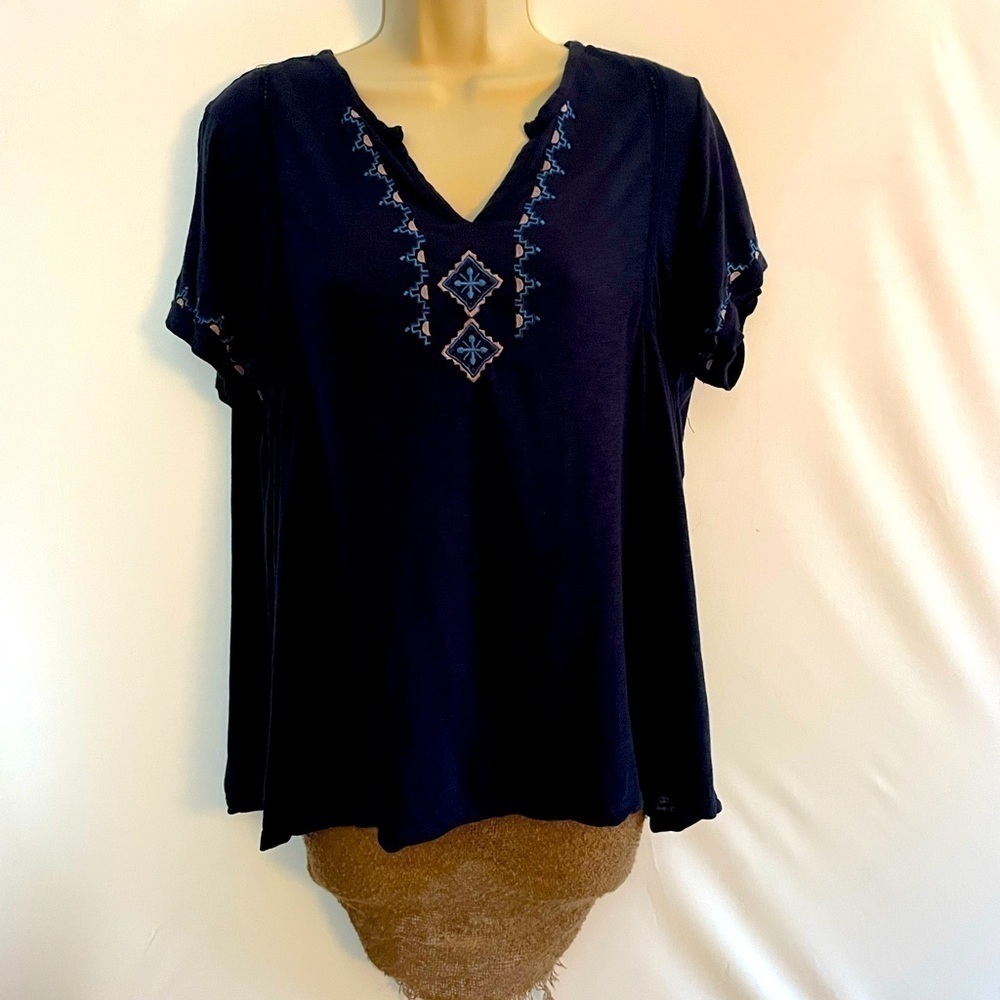 Bohemian blue shirt with tassels.